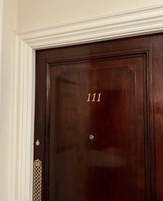 a wooden door with the number 11 on it