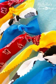 several different colored ribbons are lined up together