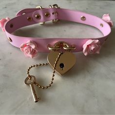 New, No Tag, But Never Worn! Choker W/ Adjustable Buckle Closure Necklace. Powder Pink Color With Gold Buckle And Lock/Key Details. Lock Actually Opens With Attached Key! Delicate Pink Rose Details Around The Choker. Purchased At Hot Topic. Perfect For Halloween And A Costume Or Valentines Day! Pink Collars For Subs, Chasity Cage Ideas, Adjustable Pink Necklace With Rose Design, Buckle Choker, Powder Pink Color, Rose Details, Rosé Details, Pink Collars, Lock And Key