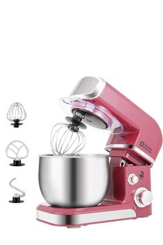 a pink mixer with three attachments in front of it