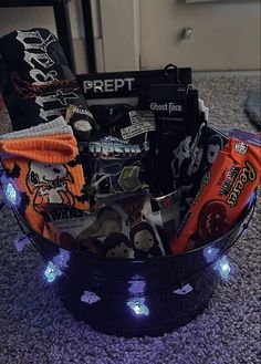 a basket filled with halloween items on top of a carpet