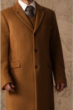 Yes, that really is the price. See why below... This classic men's top coat is made from 100% Vicuna fiber, the finest, softest and lightest natural fiber in the world. It is extremely soft, yet warm and the ultimate in luxury outerwear. This 100% Vicuna sweater is made of the finest animal fiber in the world. Luxurious Vicuna is extremely light, amazingly soft, and provides unrivaled warmth. The cape comes in a wooden box and includes a CITES certificate proving the fiber came from government c Winter Brown Sport Coat With Concealed Placket, Classic Solid Sport Coat With Pockets, Classic Brown Pea Coat With Hidden Buttons, Classic Brown Pea Coat With Hidden Button Closure, Classic Solid Pea Coat For Fall, Solid Color Wool Coat With Concealed Placket, Classic Brown Pea Coat, Solid Wool Long Coat With Concealed Placket, Classic Brown Long Wool Coat