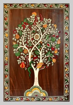 an intricately painted tree with birds and flowers on it's sides, in front of a wooden background