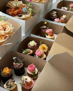 there are many different types of cupcakes in the boxes