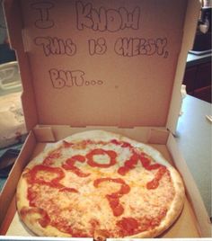 a pizza in a box with writing on it