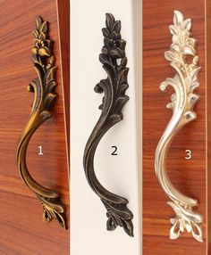 three different styles of decorative door handles