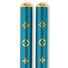 two blue lighters with gold trim on them