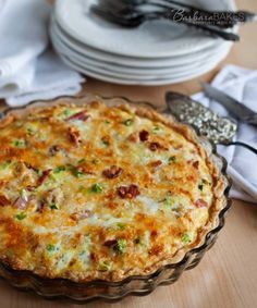 a quiche sitting on top of a wooden table