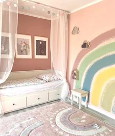 a child's bedroom decorated in pastel colors