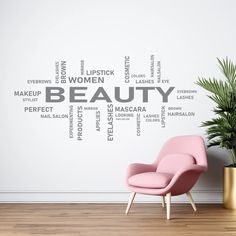 a pink chair in front of a white wall with words written on it and a potted plant next to it