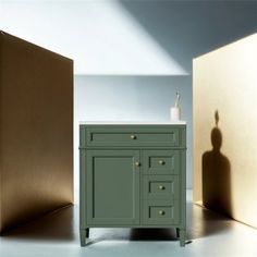 a bathroom vanity with an open door next to it and a shadow on the wall