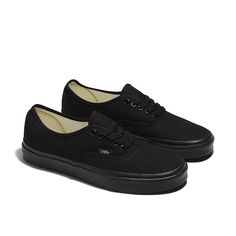 The Heritage Shoe that Started It All. This is the Authentic—Since 1966. Vans Authentic at their most stylish? That'll be the Vans Authentic all-black sneakers. What else could the answer be? These all-black sneakers eschew flashes in favor of the timeless quality of a sleek black finish, letting the sneakers speak for themselves. The simple low-top, lace-up profile continues the theme, ensuring simplicity of design and ease of use to go with the streamlined finish. Vans Authentic all-black snea All Black Vans, Vans Authentic Black, Black Sneakers Women, Vans Top, Authentic Vans, Black Vans, Vans Black, Nike Acg, School Fits