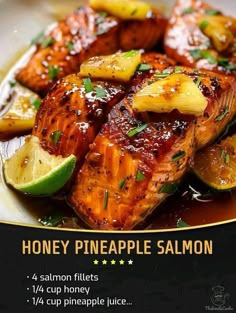 honey pineapple salmon on a plate with lemon wedges