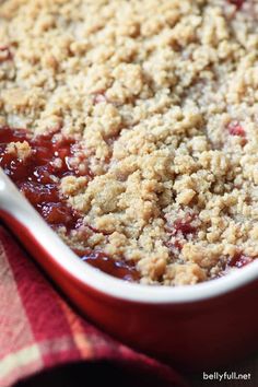 a close up of a casserole dish with crumbled toppings on top