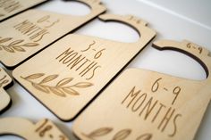 six wooden cutting boards with the names of each month printed on one side and two sides