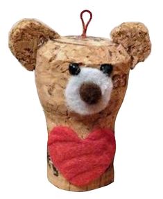 a teddy bear ornament with a heart on it