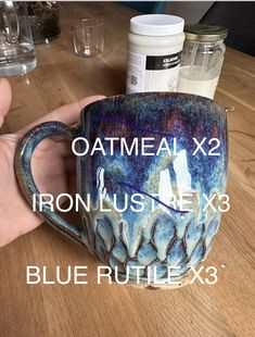 a hand holding a coffee mug with the words oatmeal x2 on it