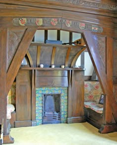 an ornate fireplace in a living room with wood paneling