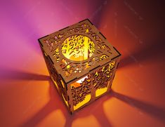 an illuminated candle holder in the shape of a box with cut out leaves on it