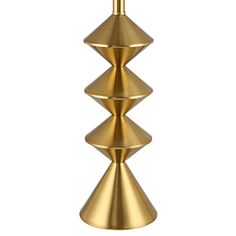 three tiered gold metal candle holder on a white background, with one light turned on