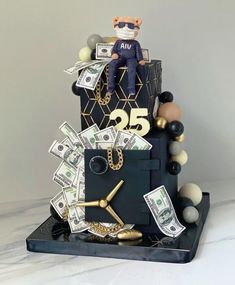 a cake made to look like it has money on top and a man in sunglasses