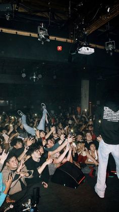 a group of people standing in front of a crowd