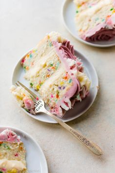 two plates with slices of cake on them and a fork in the middle one has sprinkles