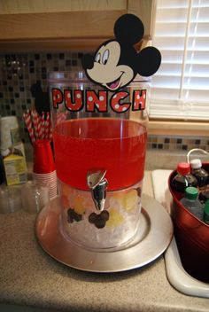 a mickey mouse punch machine sitting on top of a kitchen counter