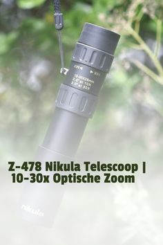 a close up of an electronic device with trees in the background and text that reads, z - 478 nikla telescoop i 10 - 30x optical zoom