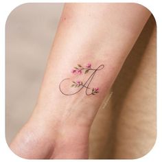 a small tattoo on the foot of a woman