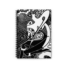 a spiral notebook with black and white art on it, featuring an abstract image of a bird