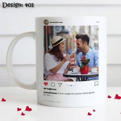 a white coffee mug with an image of a man and woman sitting at a table