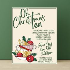 an old fashioned christmas tea party card on a wooden table with green wall and white background