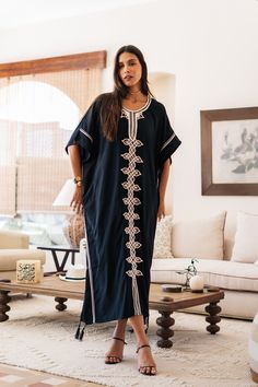 An elegant Moroccan caftan will make you feel like African royalty. It's extremely elegant with a dash of classy cotton embroidery in the front. Ideal for plus size women as well. Made of extremely soft fabric to make you feel free and beautiful at the same time.  This Kaftan is ideal to wear for any casual occasion. Whether taking a trip down the shopping lane, or home-based kitty parties, or about anything else, wearing this dress will make you feel classy and comfortable. Fabric : 70% Egyptia Oversized Cotton Kaftan, Oversized Tunic Abaya, Black Cotton Maxi Kaftan, Black Bohemian Cotton Kaftan, Black Cotton Bohemian Kaftan, Black Cotton Short Sleeve Kaftan, Embroidered Short Sleeve Kaftan For Eid, Cotton Tunic Kaftan For Eid, Cotton Free Size Kaftan