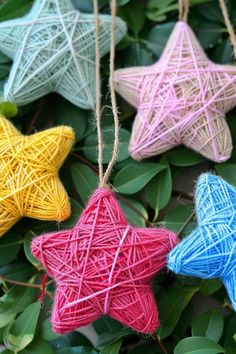 string wrapped star ornaments hanging from tree branches