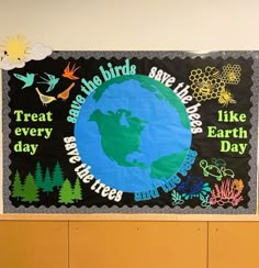 a bulletin board with an earth day theme on the front and back wall in a classroom