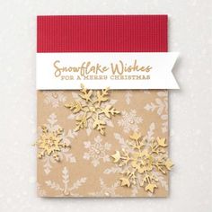 gold snowflake wishes for a merry christmas card with red ribbon and white background