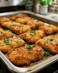 a pan filled with fried food on top of a stove