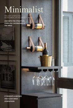 the cover of minimalist magazine with wine glasses and bottles hanging on it's wall