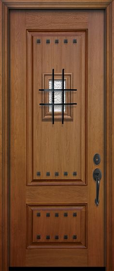 a close up of a wooden door with metal bars on the front and side panels