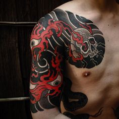 a man with a dragon tattoo on his chest