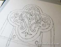 a drawing of an ornate design on a piece of paper with markers and pencils