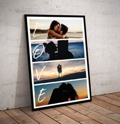 a black framed photo hanging on a wall with the words love and two people kissing