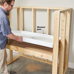 a man standing in front of a wooden bench with the bottom section removed from it