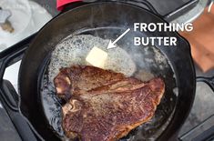 a steak is cooking in a frying pan on the stove with butter and water