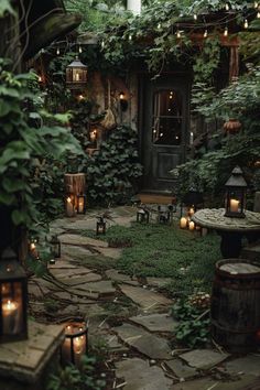 an outdoor patio with candles and greenery