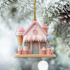 a christmas ornament hanging from a tree with an ice cream shop on it