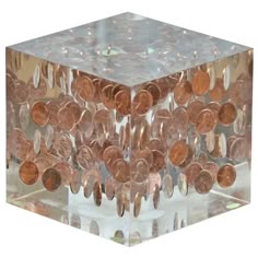 a glass block with some coins in it