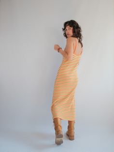 Yellow and Orange Stripe Knitted Maxi Slip Dress  Really fun colours and great fit due to the weight of the knit.  Perfect little summer dress.  Cotton Poly Blend  Tag size S Very Good second hand condition, minor wear to be expected of any second hand item. Spring Yellow Knit Dress, Fitted Knit Summer Dress, Summer Knit Fitted Dresses, Yellow Sleeveless Knit Dress, Yellow Knit Sleeveless Dress, Ribbed Midi Beach Dresses, Summer Beach Knit Midi Dress, Knit Midi Dress For Beach In Summer, Casual Ribbed Summer Midi Dress