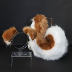 a stuffed animal is looking through a magnifying glass in front of a black background